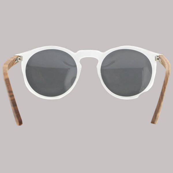 Sunglasses with round lenses and wooden frames on a white background