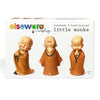 Set of three handmade hand-painted polyresin monk figurines on a white background