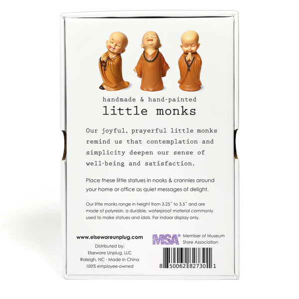 Back of packaging with three small monk figurines and product description text.