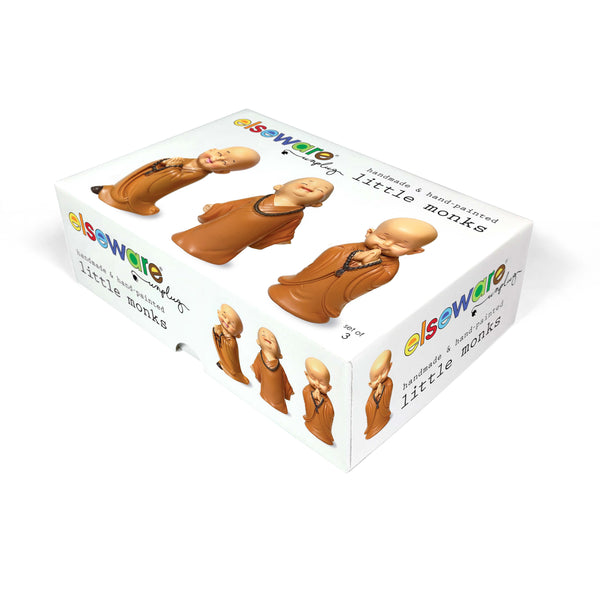 3 Little Monks figurines positioned outdoors showing weather-resistant polyresin material