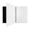 Watercolor paper pad open showing thick wood-free sheets for painting