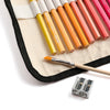 Close-up of water-soluble watercolor pencils and included paintbrush in canvas wrap