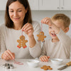 Child making gingerbread salt dough ornaments with the elseware unplug DIY Christmas craft kit