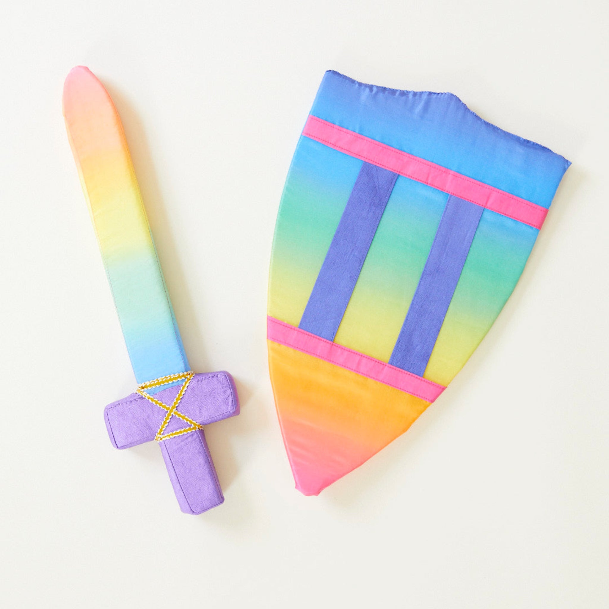 Colorful tie-dye bag and sword on a white background