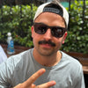 Joycoast Wayfinder Ebony sunglasses styled outdoors against natural background