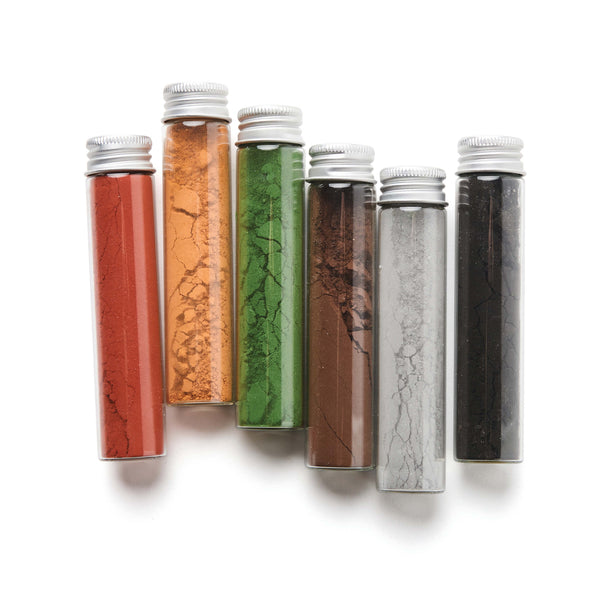 Set of six test tubes with different colored contents on a white background