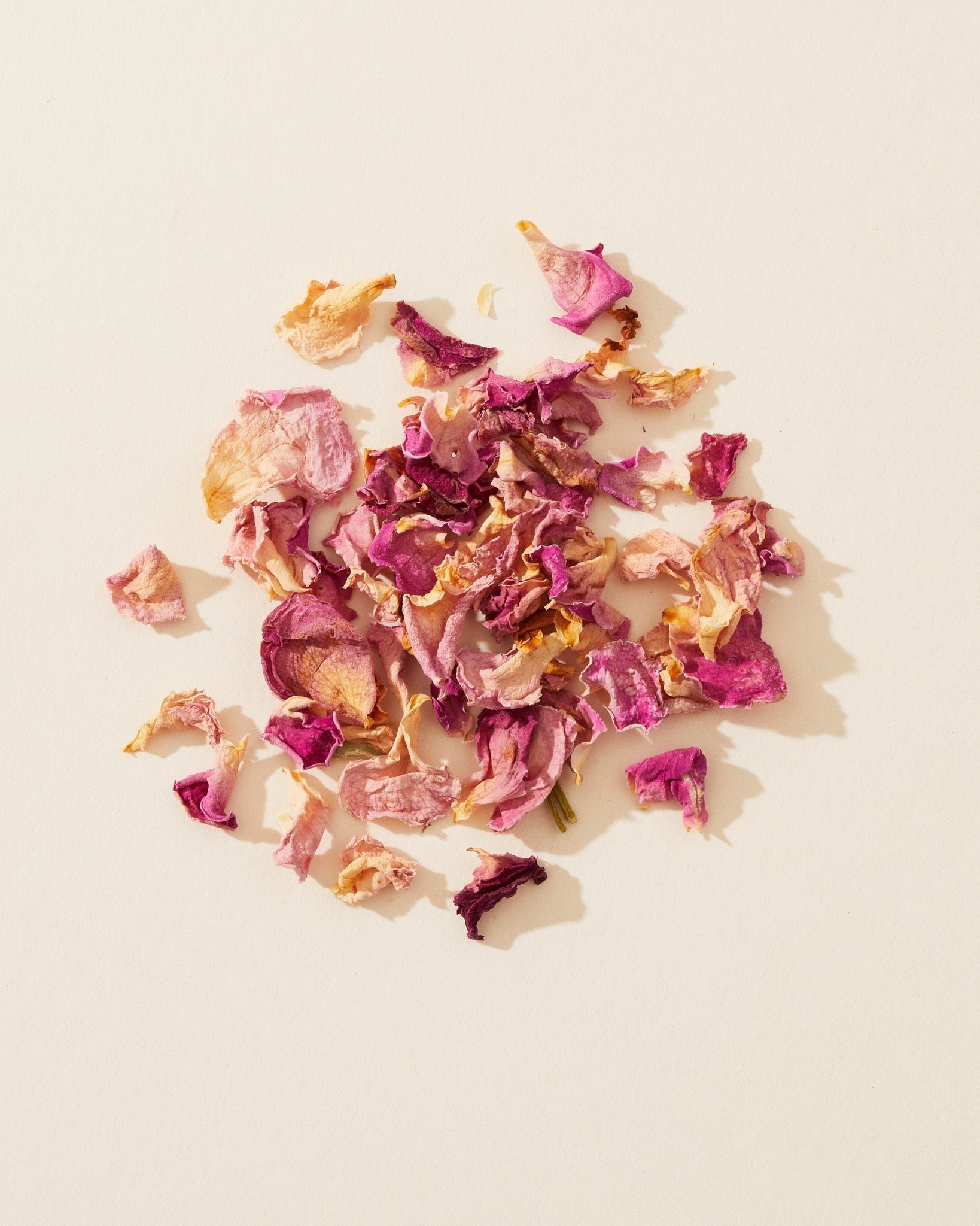 Dried red and pink rose petals used as a natural enhancer for soap and candle making