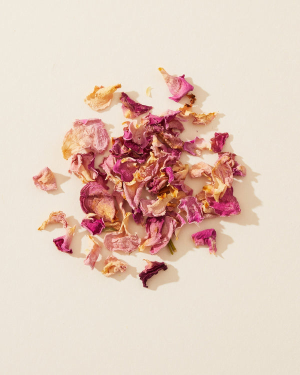 Dried red and pink rose petals used as a natural enhancer for soap and candle making