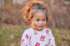 Mon Coeur floral baby dress flat lay — recycled organic cotton, made in Portugal