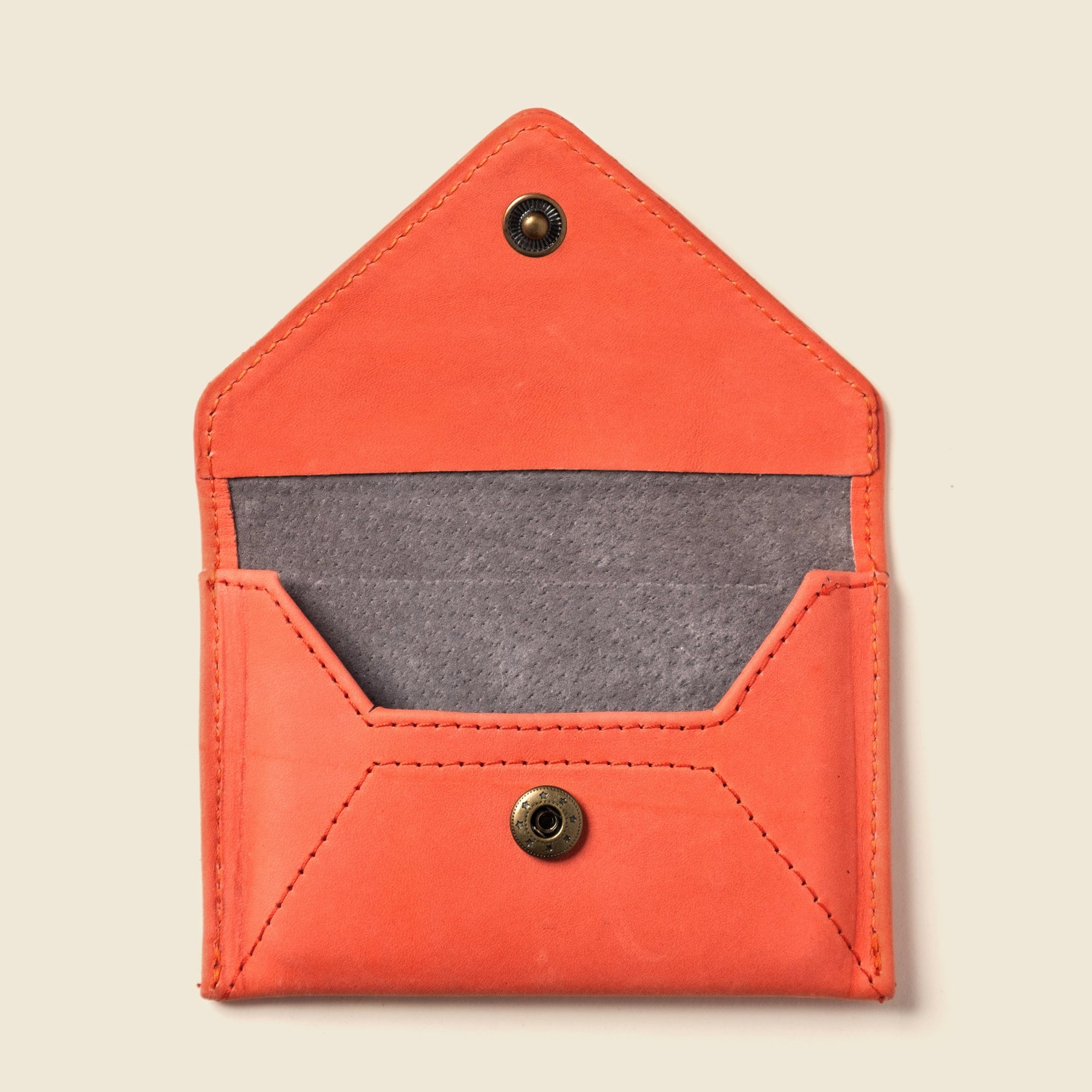 Shop the Mini Envelope Wallet in Pink—compact, RFID-blocking, and made with repurposed full grain leather. Handmade in California with sustainable elegance.

