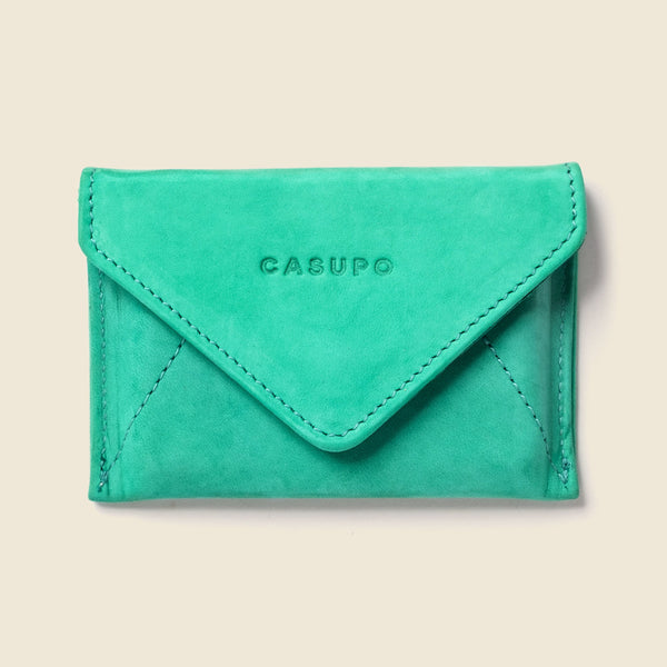 Green wallet with 'CASUPO' branding on a beige background