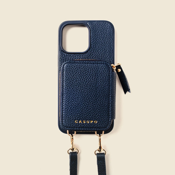 Navy blue phone case with a strap on a beige background