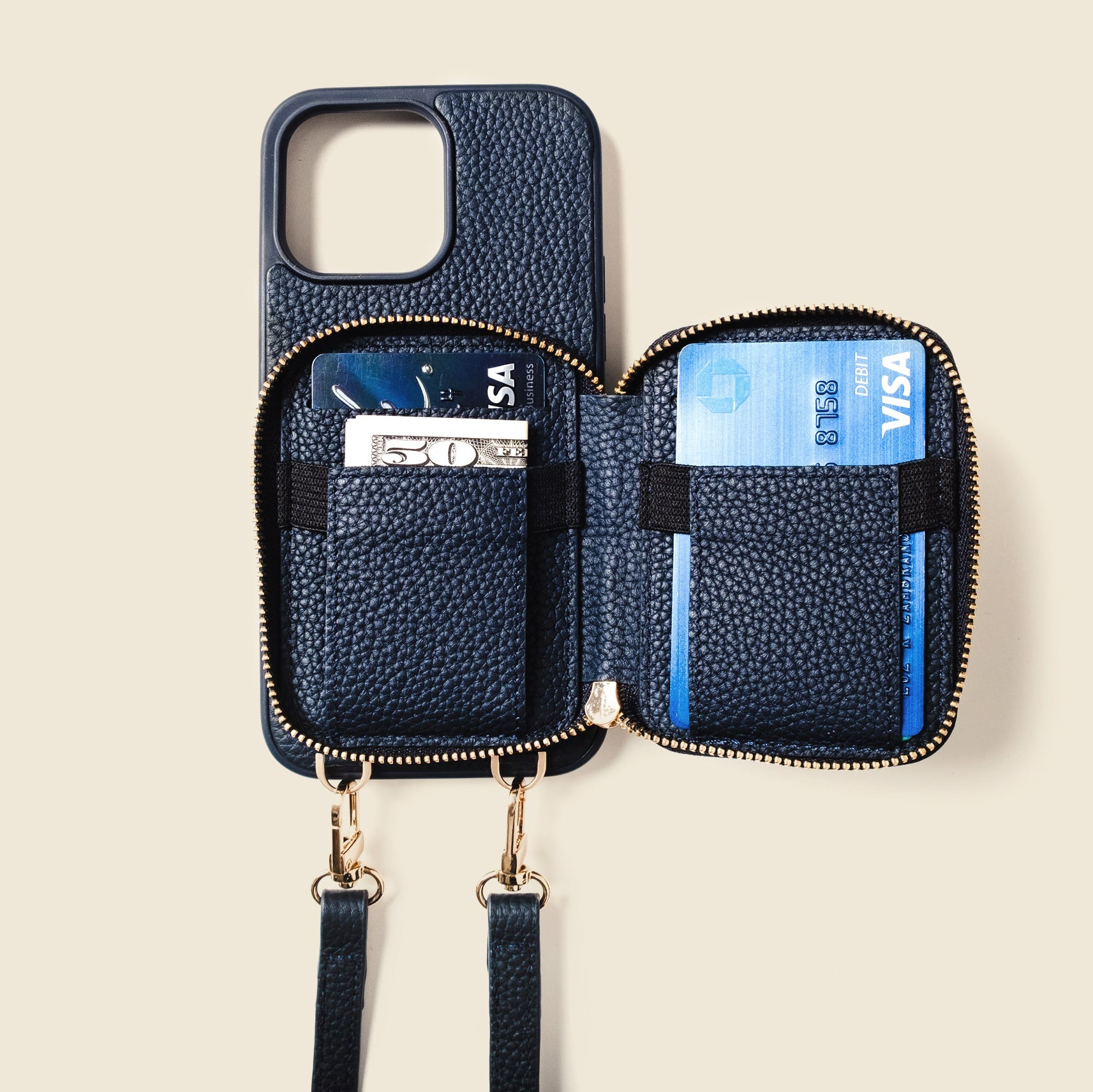 Blue phone case with card slots and a strap on a beige background