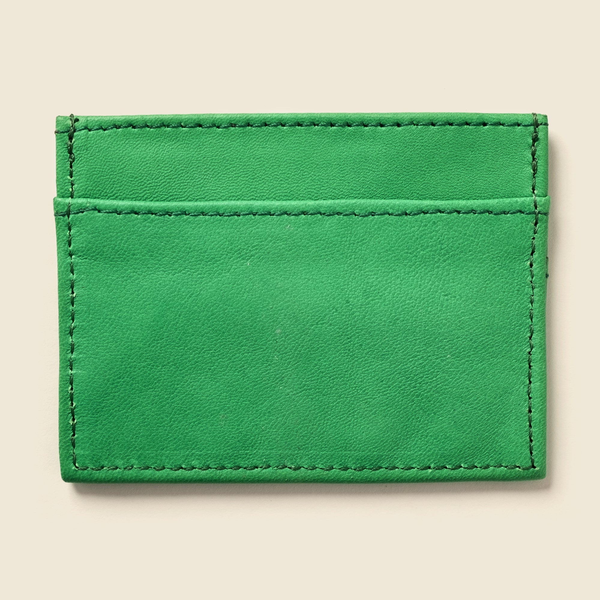 Slim and stylish RFID wallet crafted from upcycled full-grain leather—holds up to 12 cards, offers digital protection, and can be personalized. Shop eco‑friendly minimalism!

