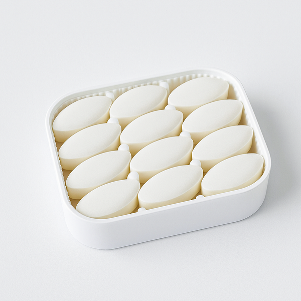 White container filled with oval-shaped objects on a white background