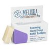 Meliora lavender scented foaming hand soap refill tablet next to its recyclable paperboard box
