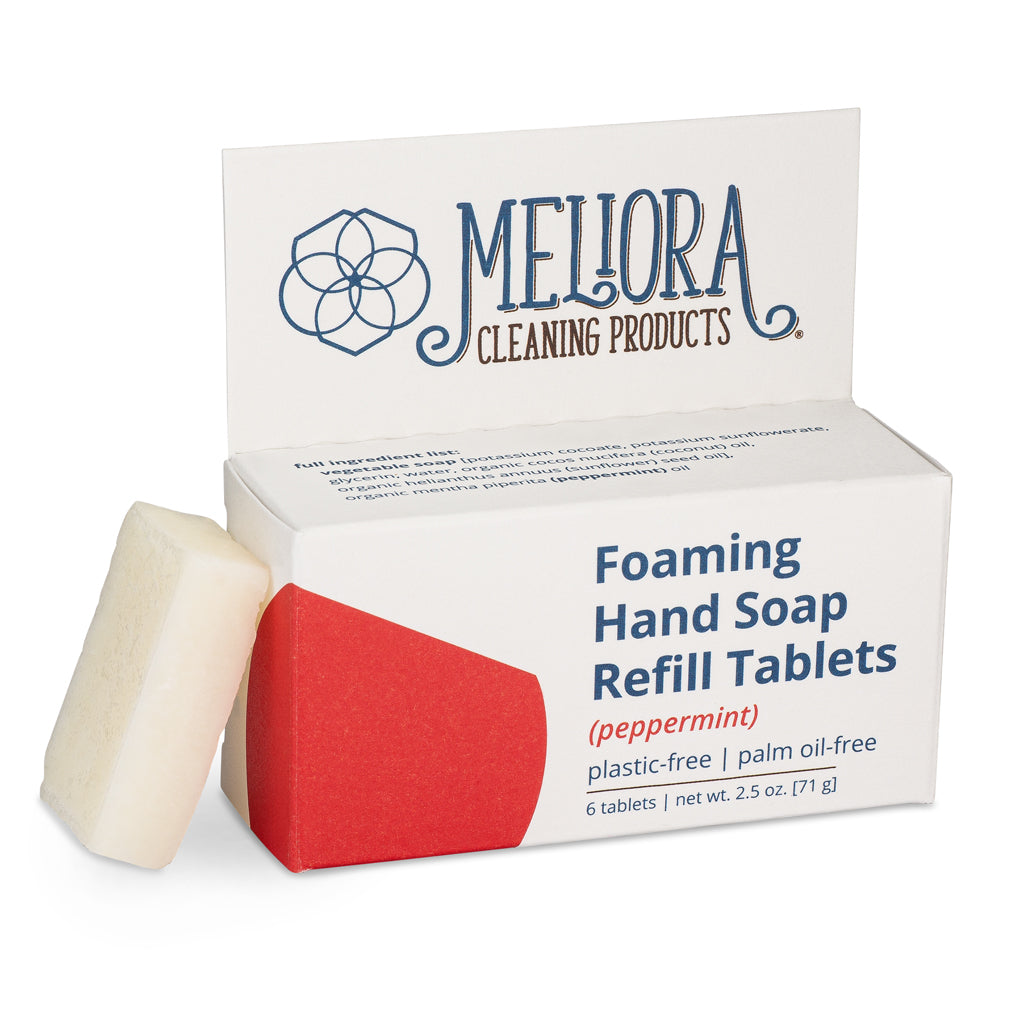 Meliora peppermint scented foaming hand soap refill tablet next to its recyclable paperboard box