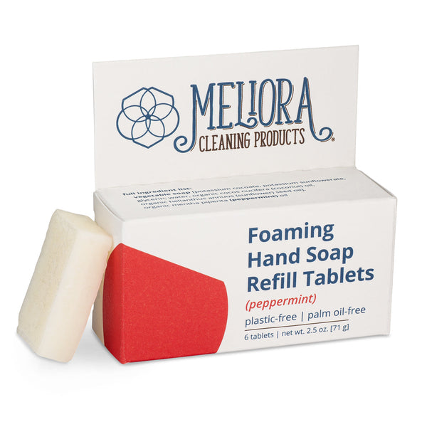 Meliora peppermint scented foaming hand soap refill tablet next to its recyclable paperboard box