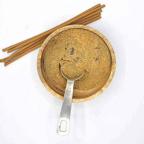Lit French lavender incense stick burning slowly with gentle smoke in a home setting