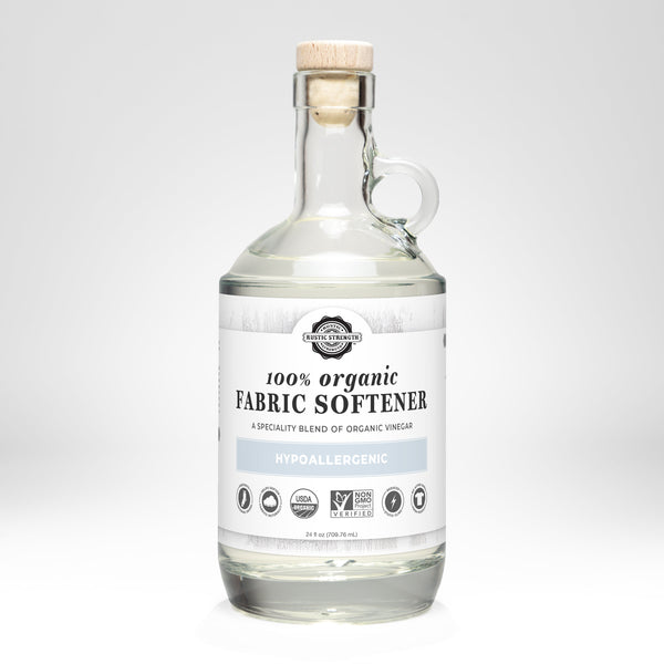 Bottle of 100% organic fabric softener with a label on a white background