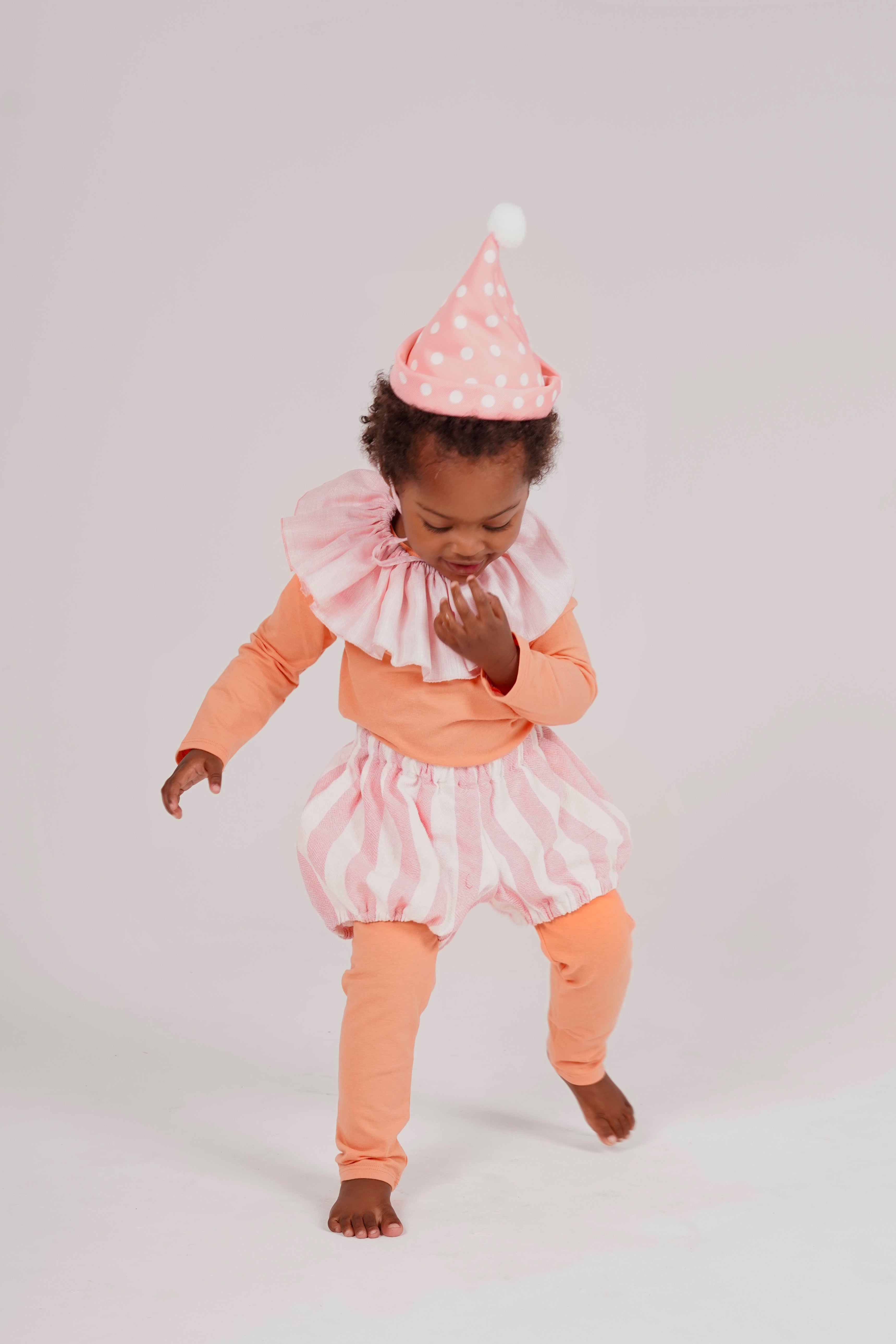 Child wearing the Pink Bloomer handmade linen bloomer by Band of the Wild