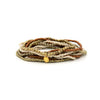 Fair Anita Burst Bracelet Set in gold and peach tones stacked on a wrist
