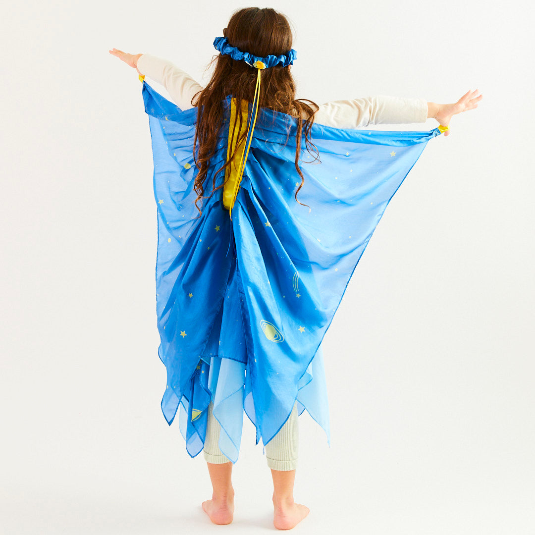 Person wearing a blue costume with star patterns on a white background