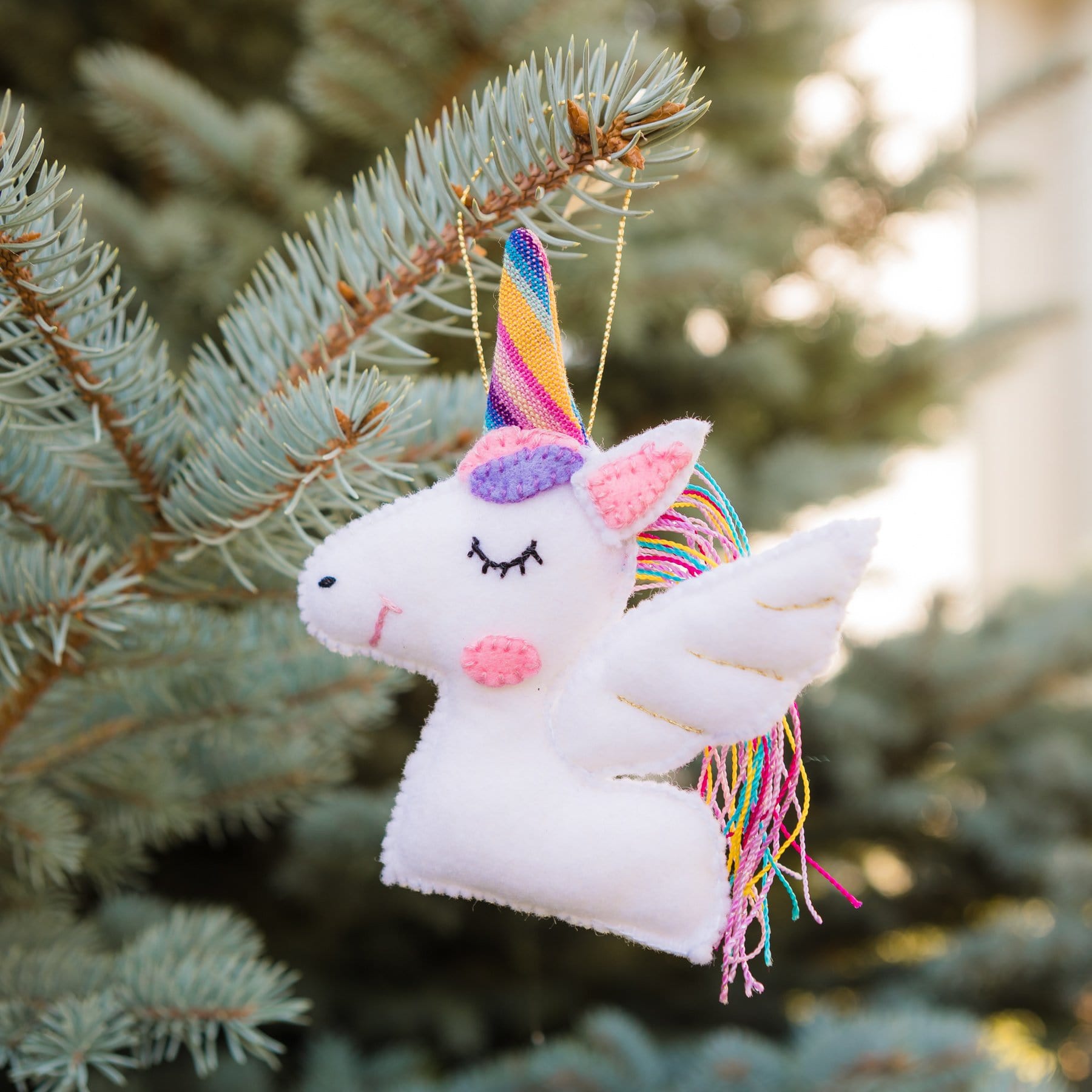 Add a touch of magic to your holiday decor with our adorable Felt Unicorn Ornament. Made from sustainable materials and featuring vibrant colors, this ornament is the perfect addition to any Christmas tree. Order yours today!