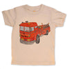 Beige t-shirt with a red fire truck graphic on a white background