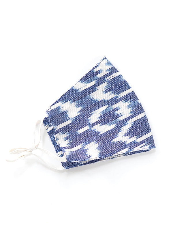 Stack of five washable adjustable cotton face masks handmade by fair trade artisans in India