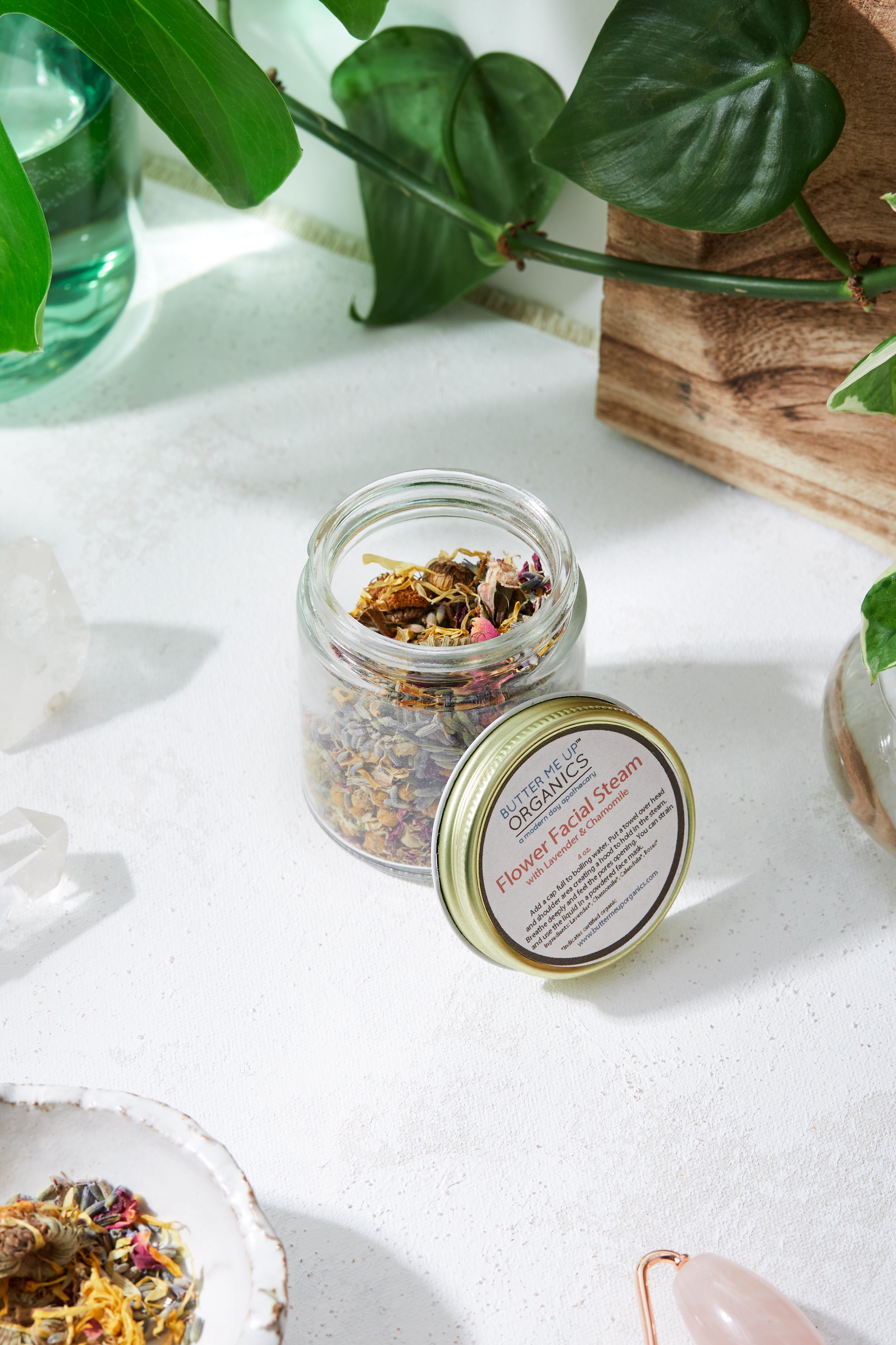 Close-up of organic flower and herb blend inside the Butter Me Up Organics Calming Facial Steam jar