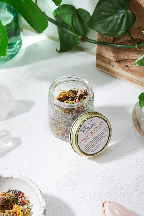 Close-up of organic flower and herb blend inside the Butter Me Up Organics Calming Facial Steam jar