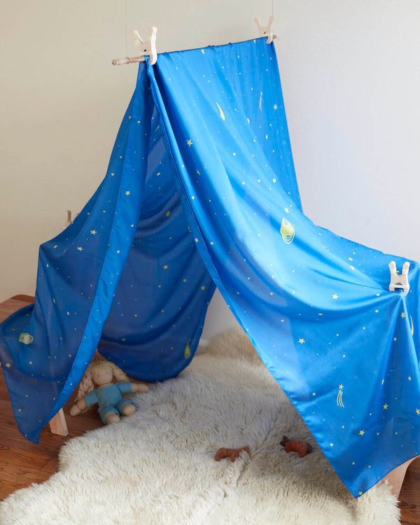 Child building a fort using a large Sarah's Silks Double Star Playsilk in rich colour
