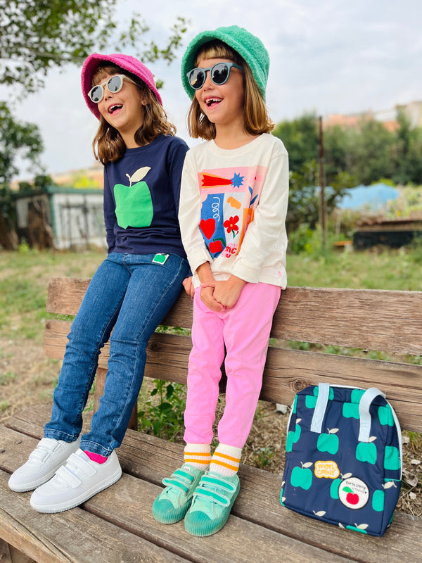 Child wearing Mon Coeur stretchy recycled cotton leggings outdoors