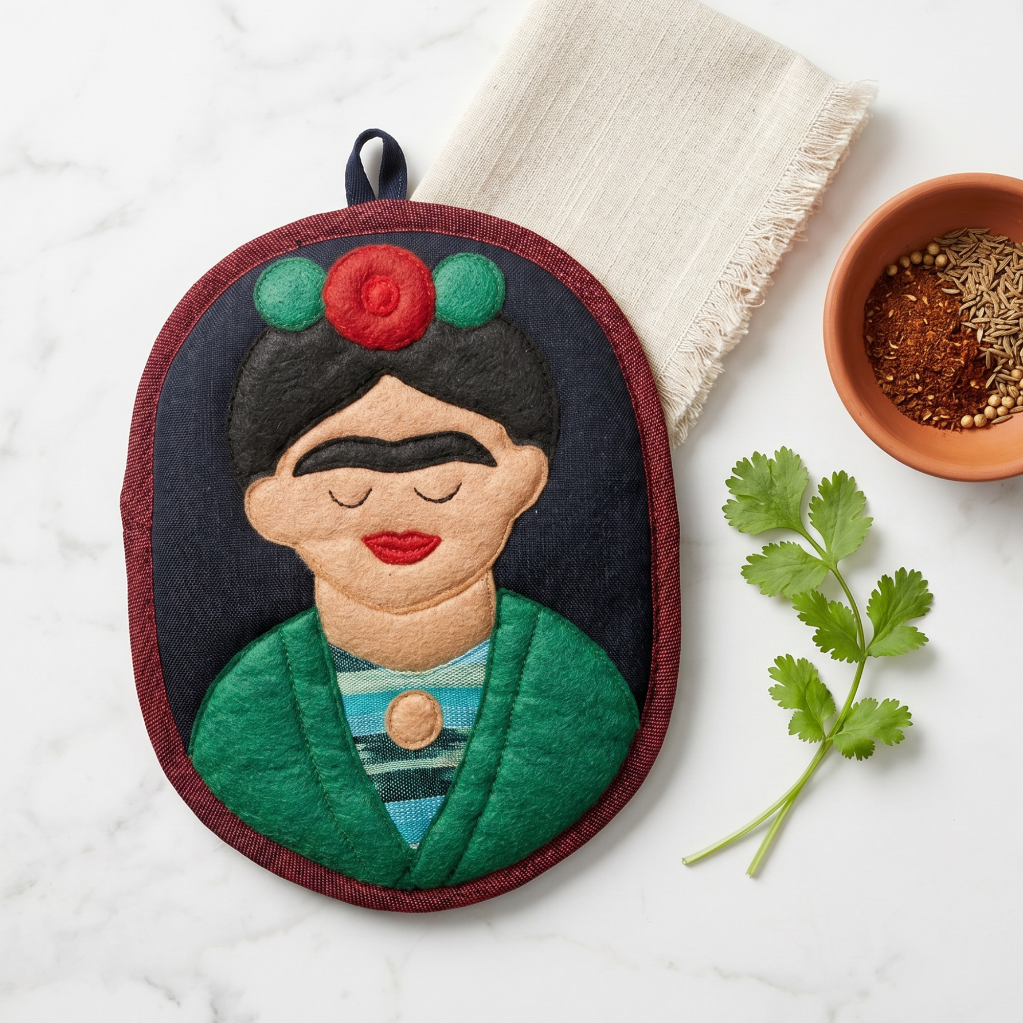 Frida the Artist Potholder, a handwoven cotton potholder from the Frida Garden Kitchen Collection