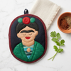 Frida the Artist Potholder, a handwoven cotton potholder from the Frida Garden Kitchen Collection