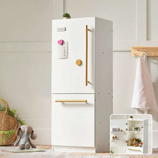 White refrigerator with gold handles in a room setting with a basket, teddy bear, and small shelf.