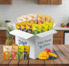 Box of Dory Oats Fruit Faves 16-pack on a kitchen counter with various fruit items.