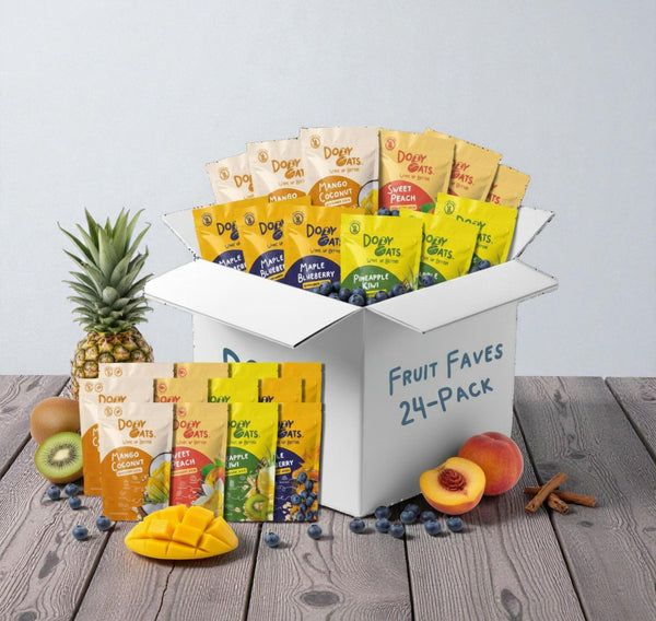 Box of Dole Fruit Faves 24-pack with various fruit snacks on a wooden surface.