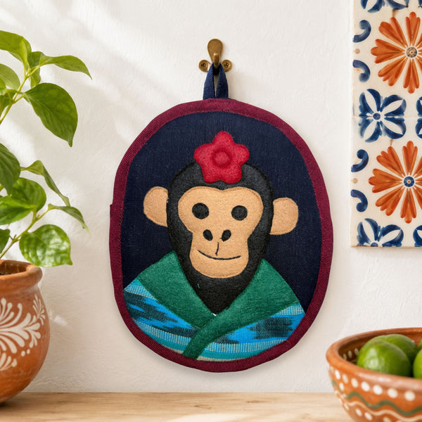 Fulang-Chang the Monkey Potholder showing its hanging loop and handwoven cotton front