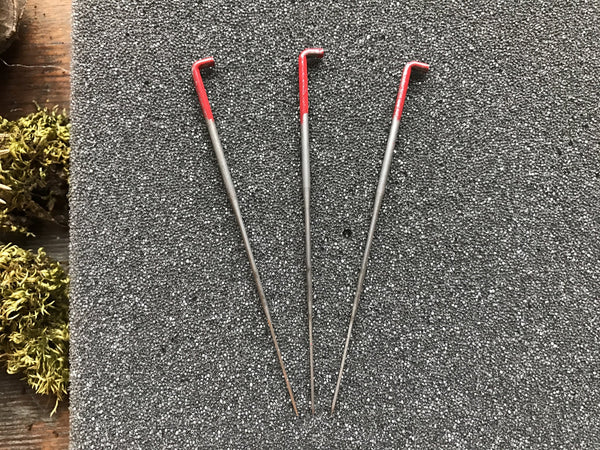 Close view of 36-gauge triangle felting needles for needle felting wool roving