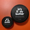 Jo's Whipped Body Butter in a jar showing creamy texture — made with organic shea butter, cocoa butter and grapeseed oil