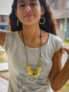 Full Moon Artillery Necklace in brass finish — recycled bullet casing jewellery, fair trade