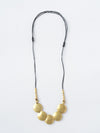 Full Moon Artillery Necklace in brass worn as a layering necklace — ethical jewellery by Fair Anita