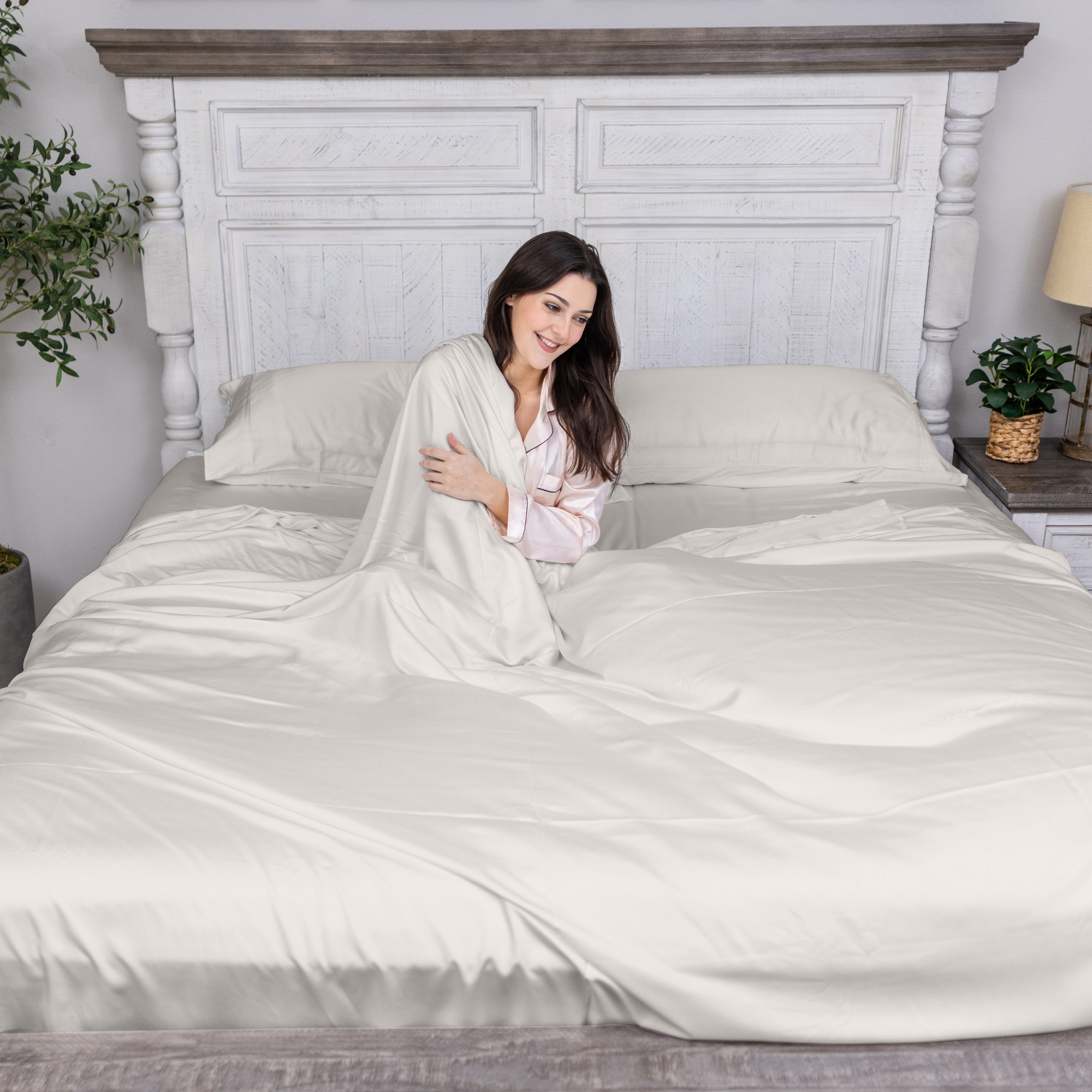 Greenleaf Linens organic bamboo sheets set in ivory laid out with sleep mask gift