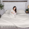 Greenleaf Linens organic bamboo sheets set in ivory laid out with sleep mask gift
