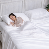 Greenleaf Linens organic bamboo sheets set in raisin colour styled on a bed