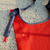 HowBottle Little Snake limited edition red recycled bag with adjustable strap on a textured surface