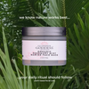 Glimmer Goddess organic rosemary mint marine face mask jar with green leaves in the background