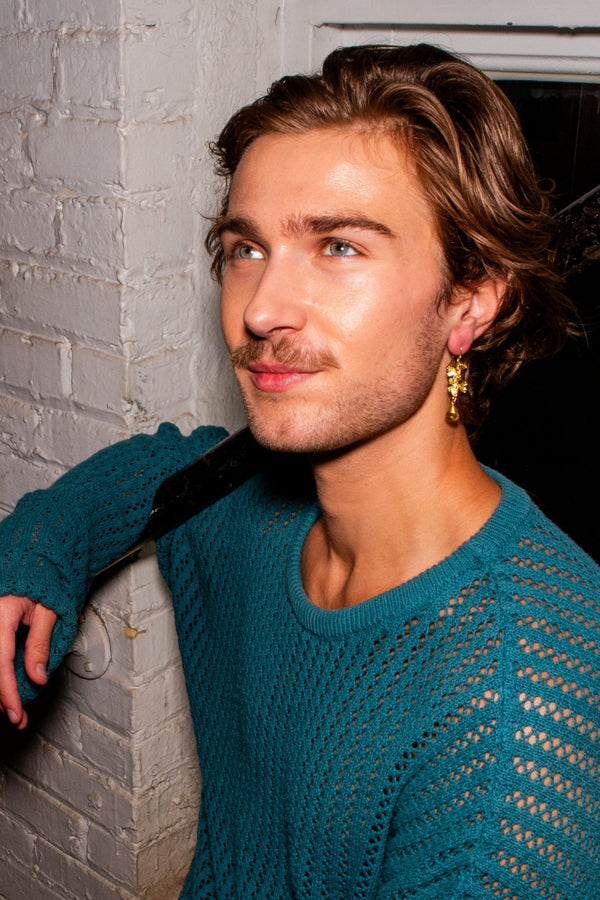Close-up of Fair Anita Golden Clover Field Earrings showing gold-plated recycled brass finish and delicate clover detail